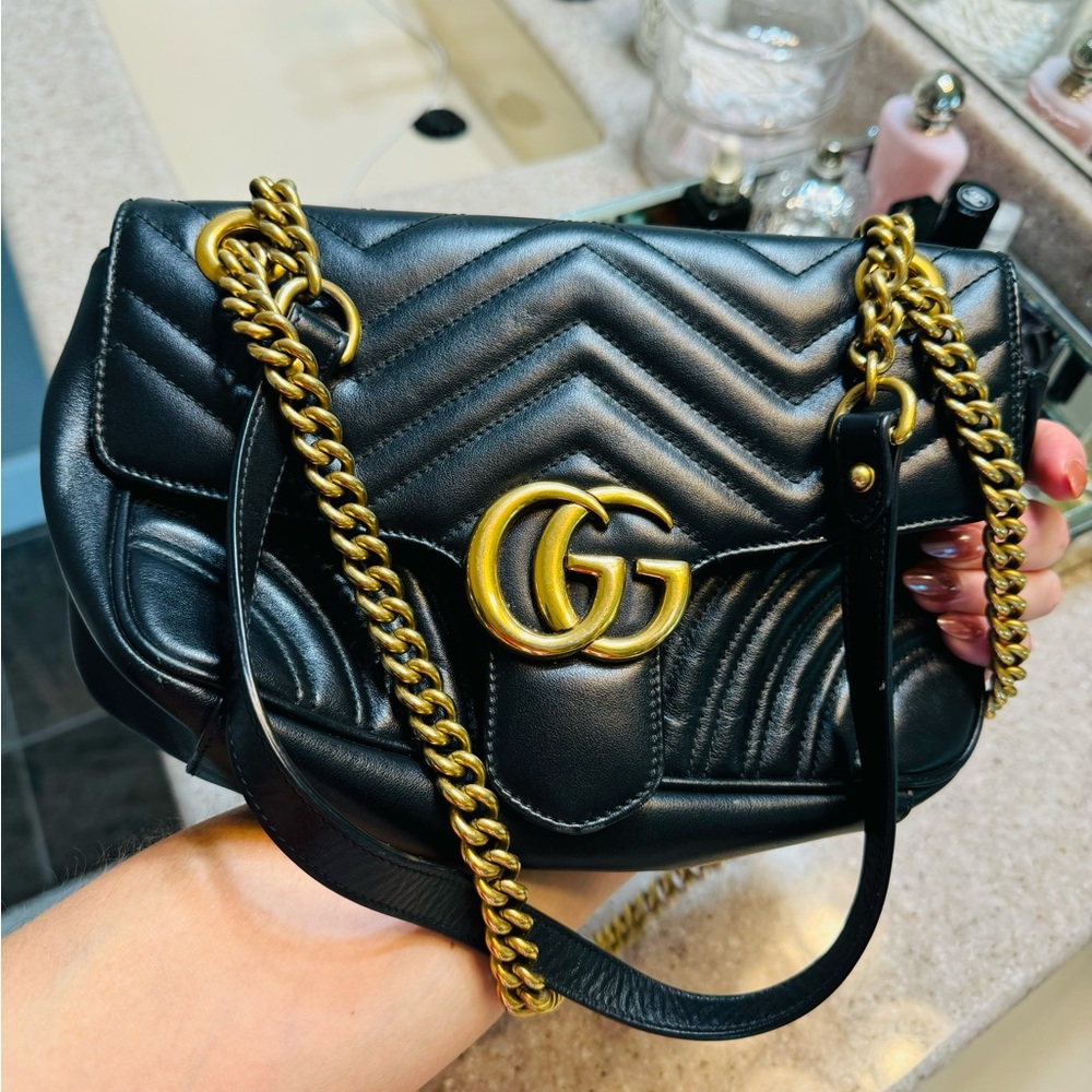 This is an authentic GUCCI Calfskin Matelasse Small GG Marmont in Black.